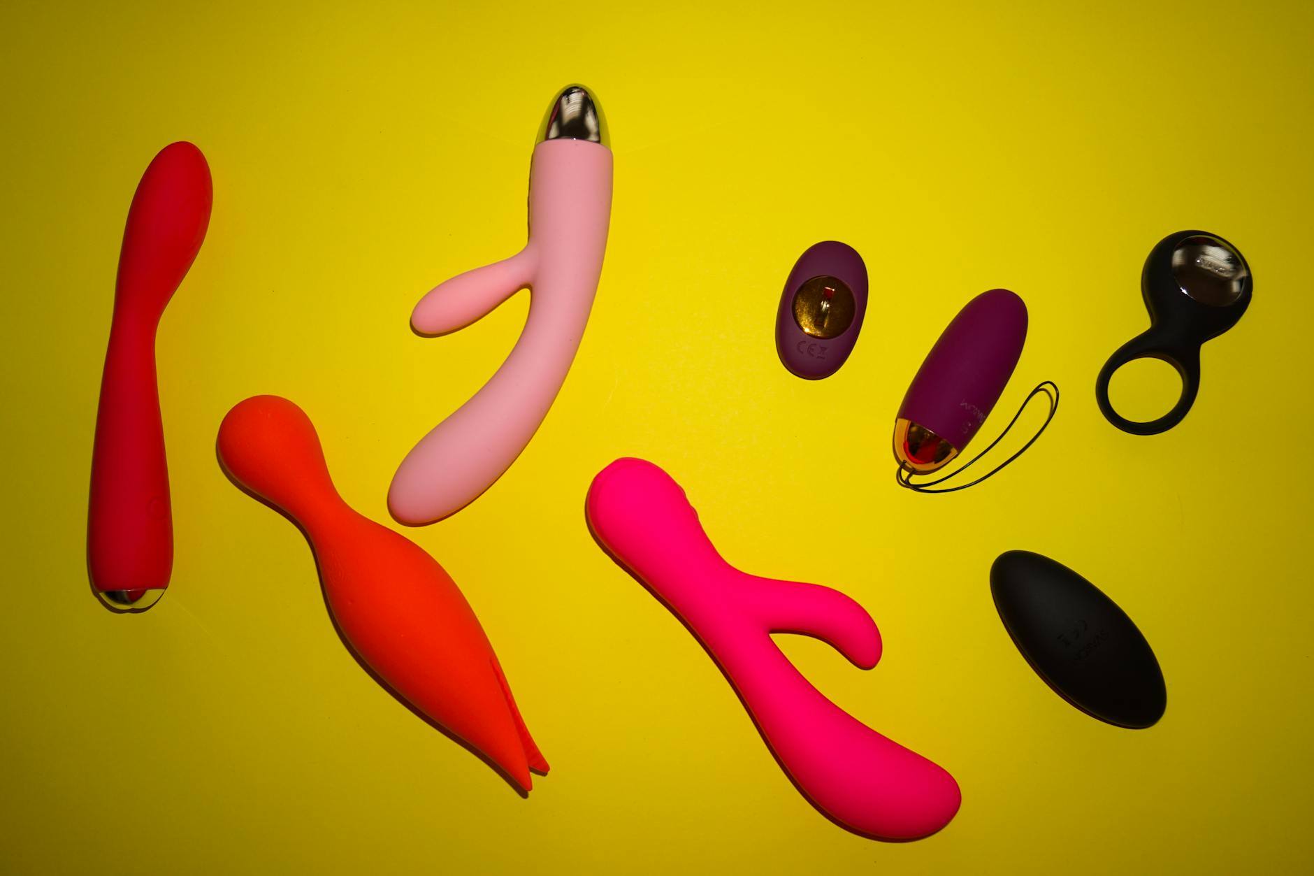 Close-up of a hand holding a fresh lemon, illustrating the citrus-inspired design philosophy behind lemon vibrators